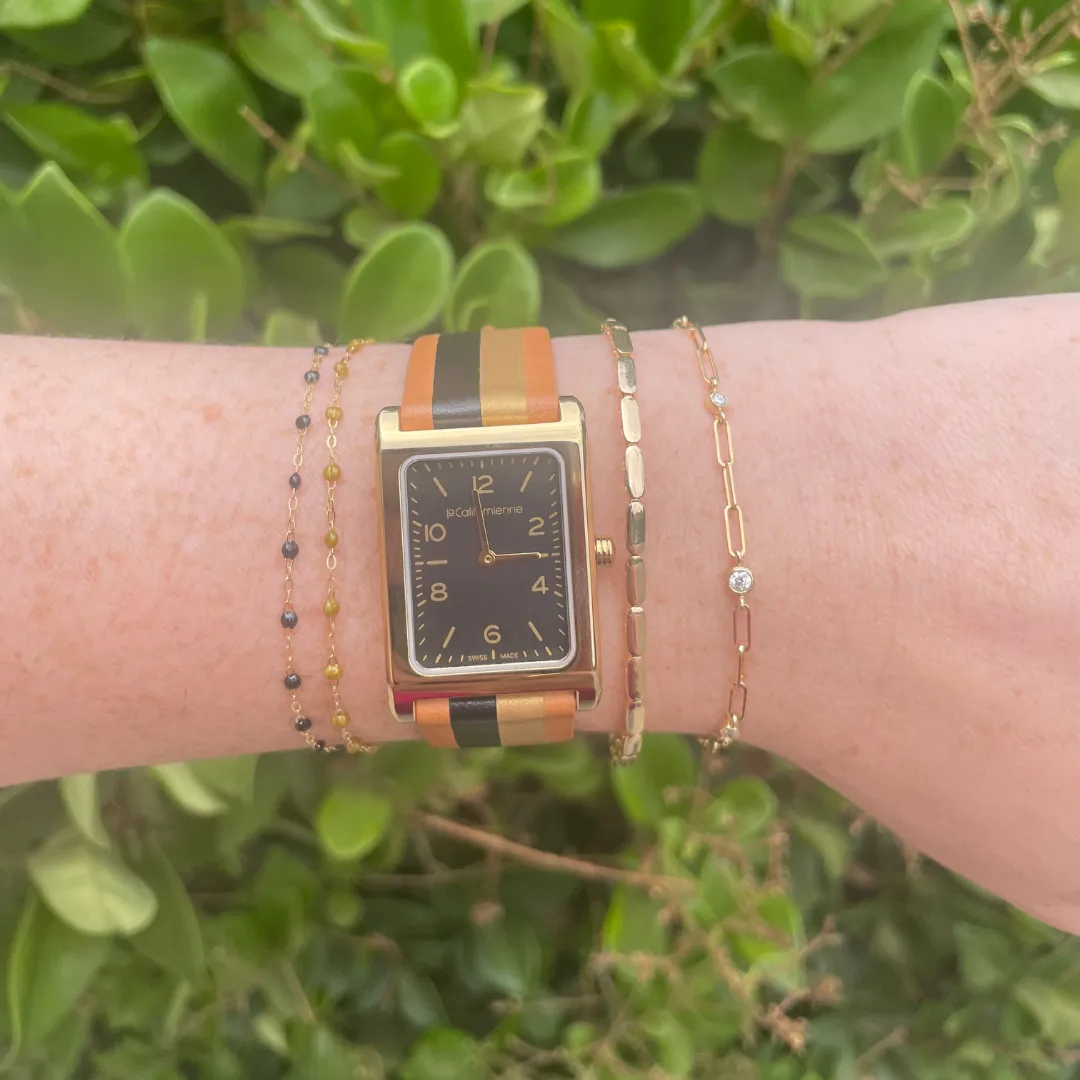 Daybreak Watch in Black and Gold