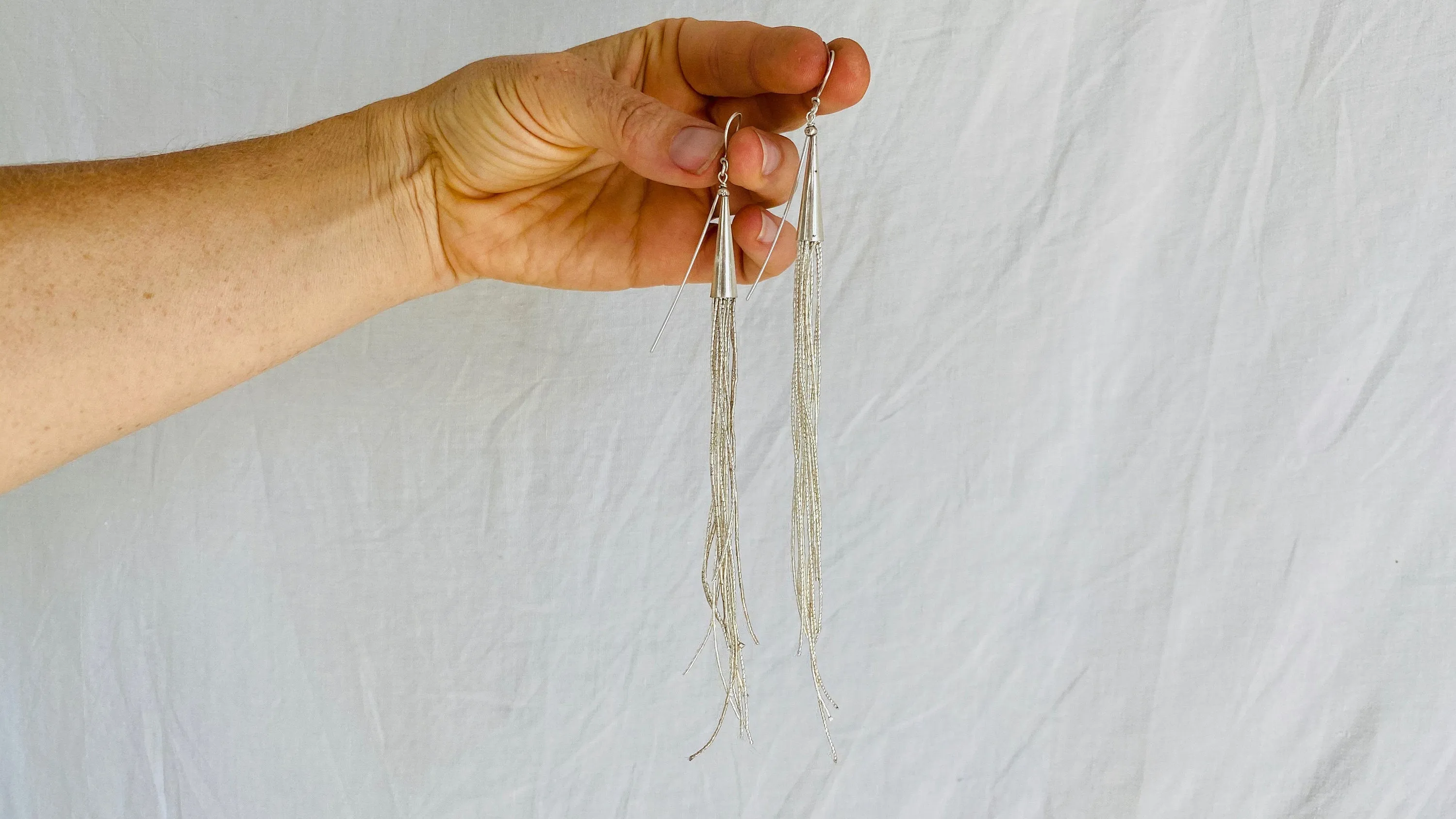 Long Liquid Silver Earrings. .99 Silver